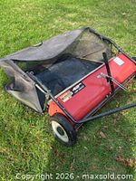 Overall view of Agri-Fab lawn sweeper showing hopper and housing