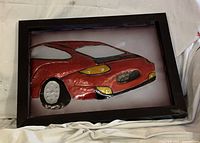 Front view showing entire framed metal car artwork
