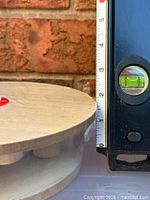 riser next to ruler showing approximate height and sealed packaging