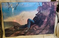 Full view of signed Daryl Hall poster showing mounting and shrink wrap