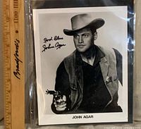 Full view of signed John Agar photo with ruler for scale