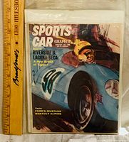 Front cover showing magazine title, date, price, and race car image