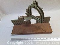 Overall view of vintage mitre saw guide with ruler for scale