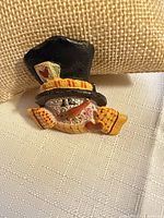 Front view of snowman brooch showing design details