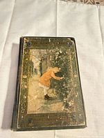 Front cover showing title, illustration, heavy wear