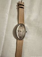 Watch laid flat showing full strap and face