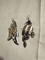 Front view of both earrings showing cascading oval charms