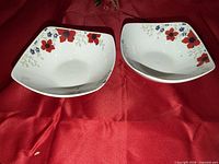 Top view of both bowls showing overall shape and floral rim design