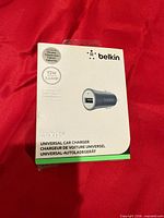 Front of sealed Belkin Mixit+ car charger box showing product and specs