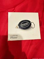 Front of sealed box showing Power Pod charger image and iPhone compatibility