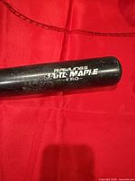 Close-up of Rawlings Maple Pro logo on barrel