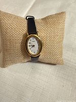 Front view of Timex watch on display pillow showing dial and strap