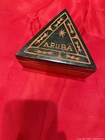 Triangular wooden Aruba trinket box closed, lid detail