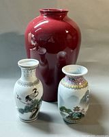 Front view of all three vases showing size and designs