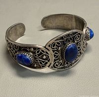 Full view of sterling silver cuff with lapis stones