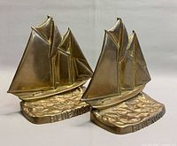 Front view of both solid brass Bluenose ship bookends