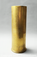 Full side view of brass shell casing