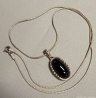 Full view of sterling chain with black obsidian pendant