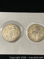 Obverse of both 1995 Marshall Islands Peace $5 coins in flips