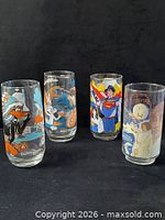 Front view of all four glasses displaying character artwork