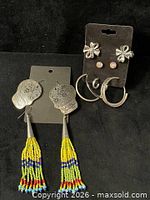 Group view of all five earring pairs on display cards