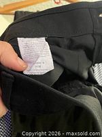 Inside care/size tag of black hoodie