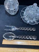 Candy jar, butter dish, fork, spoon overview with ruler for scale