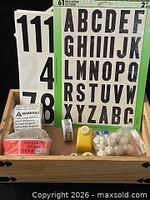 Overall lot in wooden tray showing stickers, punches, tape, beads