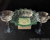 Front view of bowl flanked by two coupe glasses