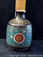 Full view of vase showing pattern and size reference