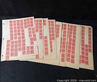 Several album sheets filled with red postage due stamps