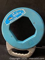 Front view of reel showing overall form and label