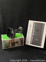 Doorbell box beside camera cover and mount