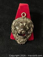 Front view of lion head pendant showing detail and bail