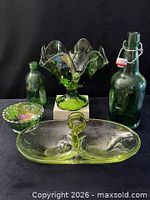 All five green glass items grouped together