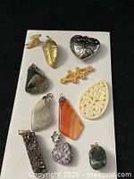 Group shot showing all 12 pendants and charms