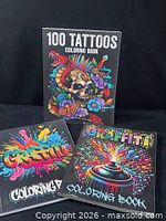 Front covers of 100 Tattoos and two Graffiti coloring books
