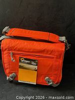 Front view of Lowepro Nova Sport 17L AW bag with tag attached