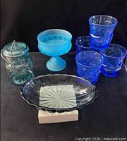 Group shot showing all seven glass items together