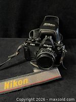 Front view of Nikon FM2 with lens, strap visible