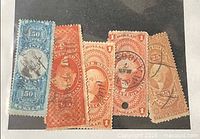 Group shot of all five revenue stamps