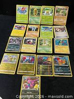 Front view of all 17 Pokémon cards laid out