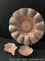 Front view of large platter with two small dishes