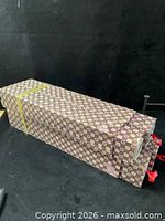 Four patterned storage boxes for scrolls, closed