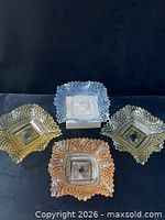 Four square pressed glass dishes in different colors, diamond pattern