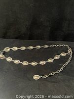 Full view of belt showing concho links and extension chain