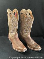 Full view of both boots standing upright