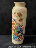 Front view showing bird and floral decoration and cream crackle glaze