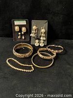 Group shot of all bracelets and earrings