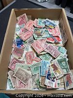 Box of assorted cancelled U.S. postage stamps